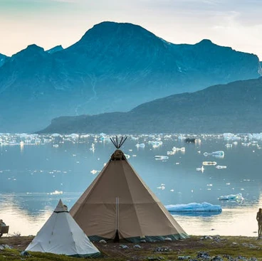 A local tent overlooking a lake