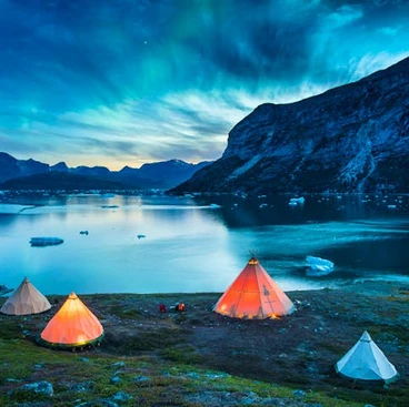 Colourful tents overlooking a beautiful lake