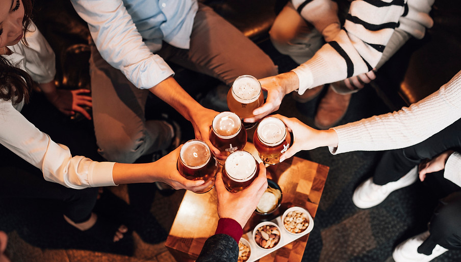 people enjoying drinks at happy hour