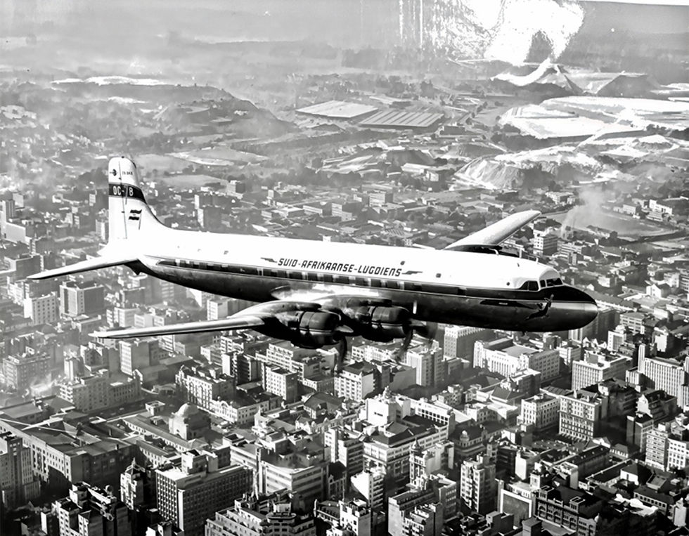 A DC- 4 Skymaster of South African Airways flying over Johannesburg