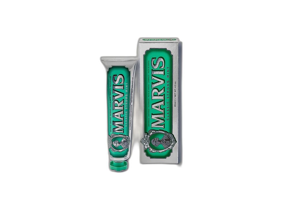 Marvis Classic Strong Mint toothpaste tube on a cream product tile