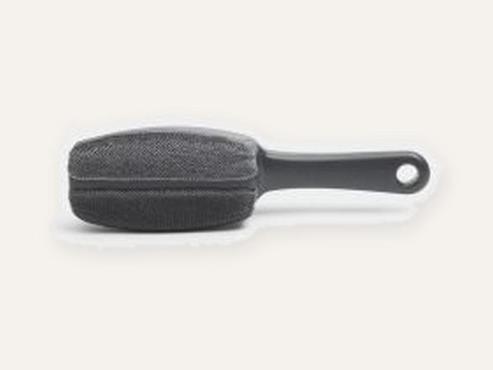 Brabantia Clothes Brush Dark Grey product image on a cream Hiinghams tile