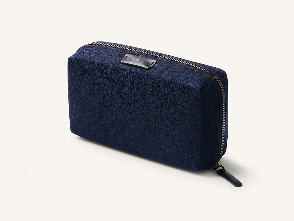 Navy Bellroy Tech Kit Compact on a cream product tile
