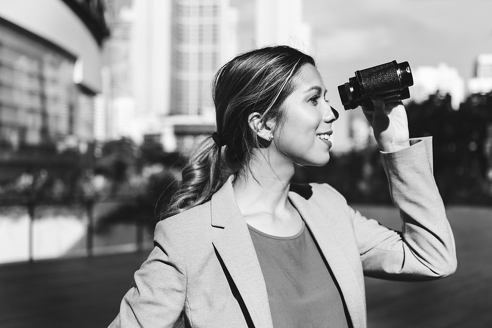 woman in suit with binoculars