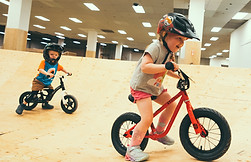 Two young children attending a Birthday Party at North Shore Bike Park