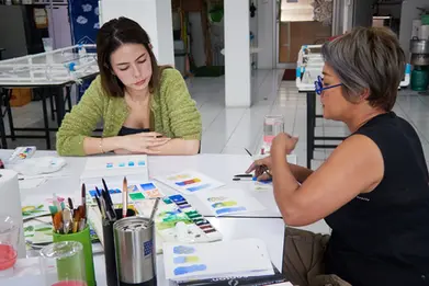 Participants practicing brush control during a Watercolor Painting workshop at GIGIPAYNE Studio in Bangkok