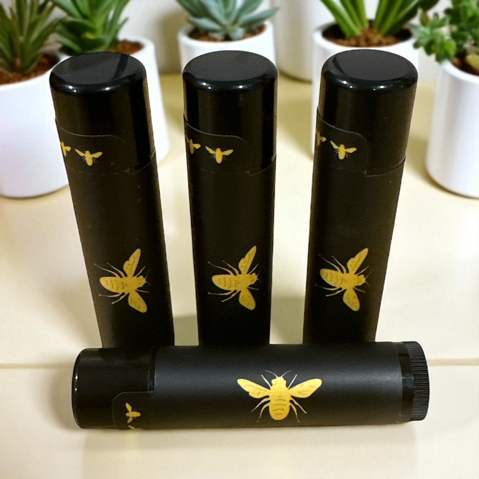 Four black tubes of Bee The Goat Natural Beeswax Chapstick