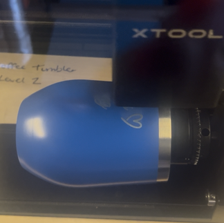 Thermal cup being engraved