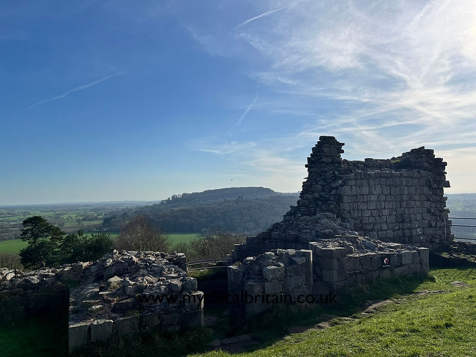 View from the ruins of the inner ward at Beeston Castle towards Peckforton Castle, a Victorian stately home made in the style of a grand medieval castle.