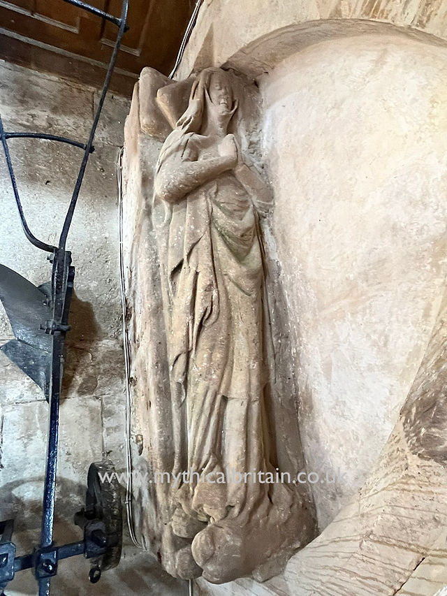 Stone effigy of a medieval woman
