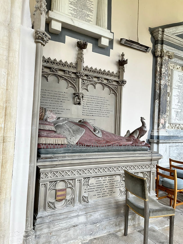 Effigy of a lord on a painted tomb chest in a church
