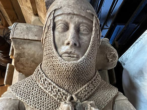 Carved alabaster face, armour and helmets of a medieval knight