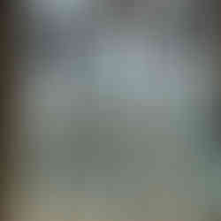 Church window showing early panels of stained glass in circular settings