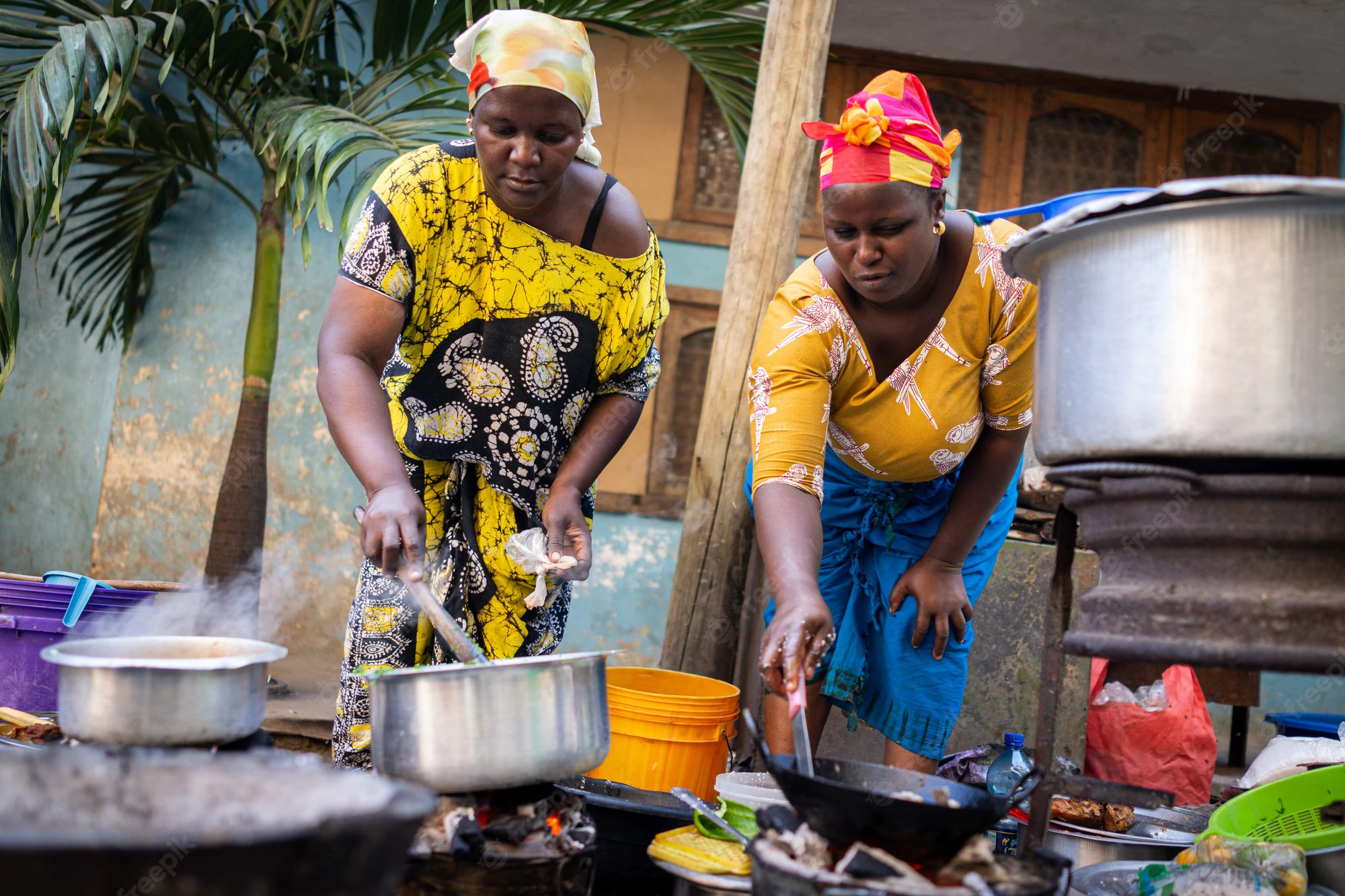 african-woman-cooking-traditional-food-street_21730-14478.webp