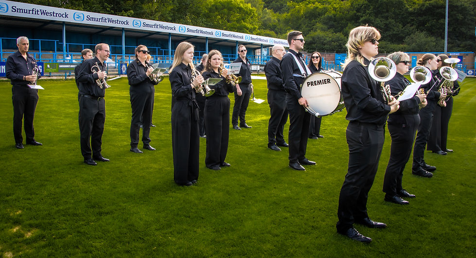 The band ready to march at Stalybridge Celtic Football Club