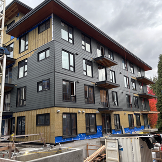 Hardie lap siding installation with Blueskin membrane, Rockwool insulation, and vertical strapping by West Royal Contracting Ltd. in Coquitlam, BC.