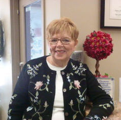 Image of a woman with short hair smiling