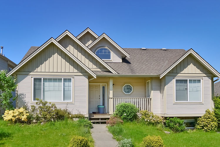 Average residential house in Canada on blue sky background