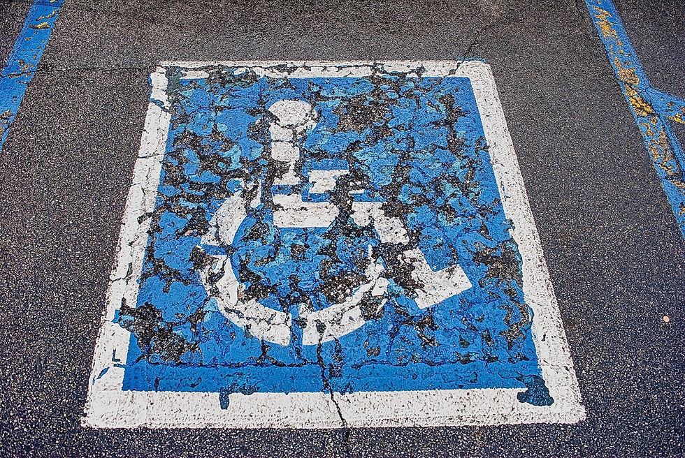 A handicap man with cracks running through it.