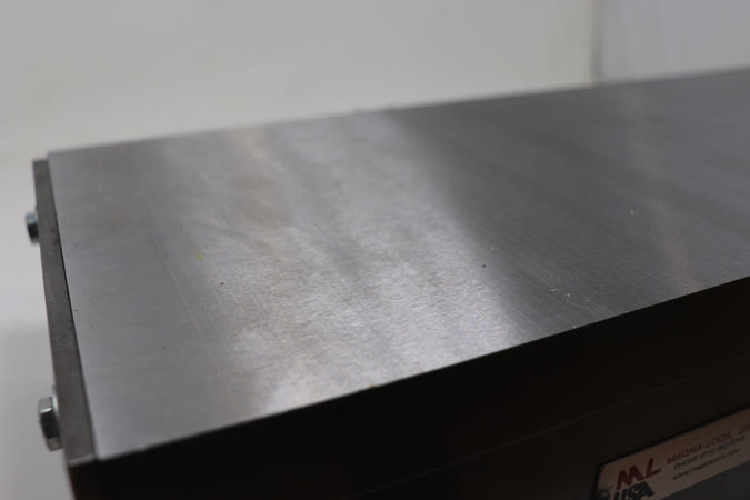 Close view of the top plate showcasing the closely spaced transverse magnetic pole pattern