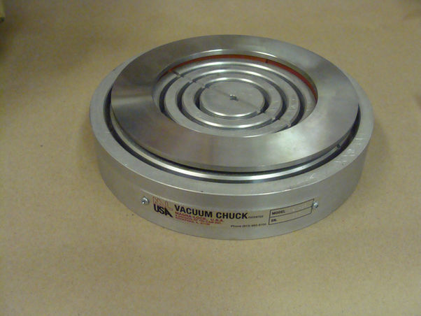 Rotary Vacuum chuck holding non magnetic material for machining.