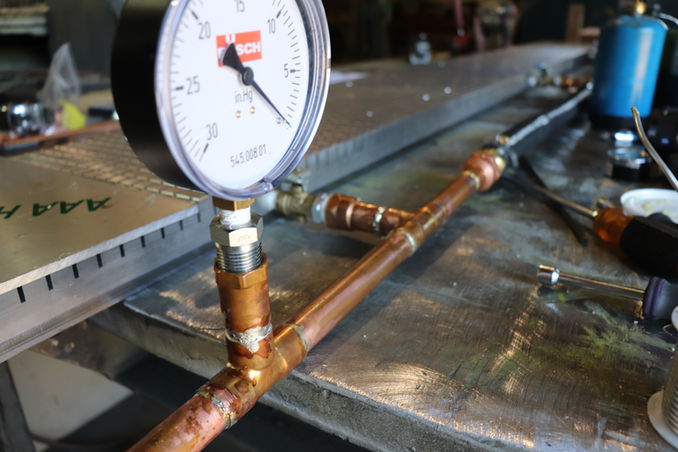 Close up of Busch industrial vacuum gauge measuring pressure.