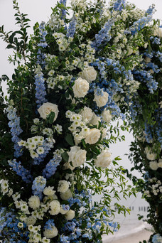 Tyde at Walnut Beach Wedding floral arch with white roses and bluebells and blue flowers