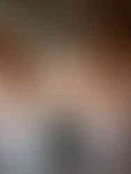 Elegant long reception table at a destination estate wedding with layered fall florals, candlelight, and gold place settings