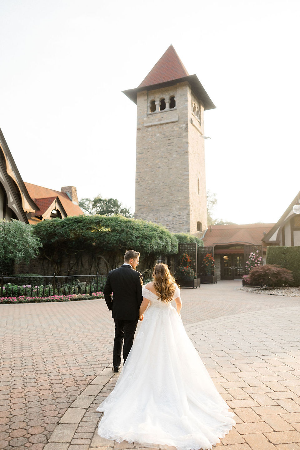 bride and groom walking toward saint clements castle in Portland connecticut