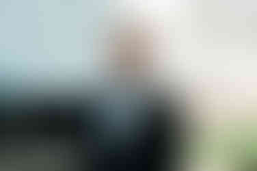 groom-awaiting-first-look-at-garden-wedding