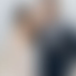 bride and groom smiling at each other on the beach at waters edge resort and spa wedding in Westbrook ct