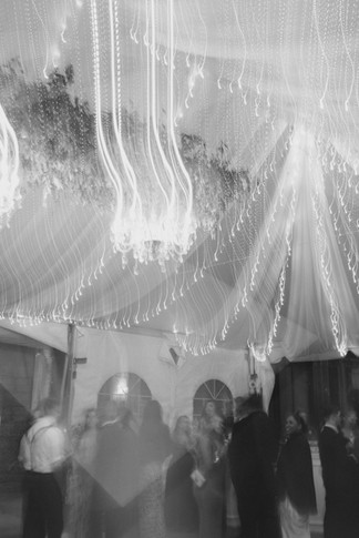 Black and white photo of tented reception dance floor at Eolia Mansion