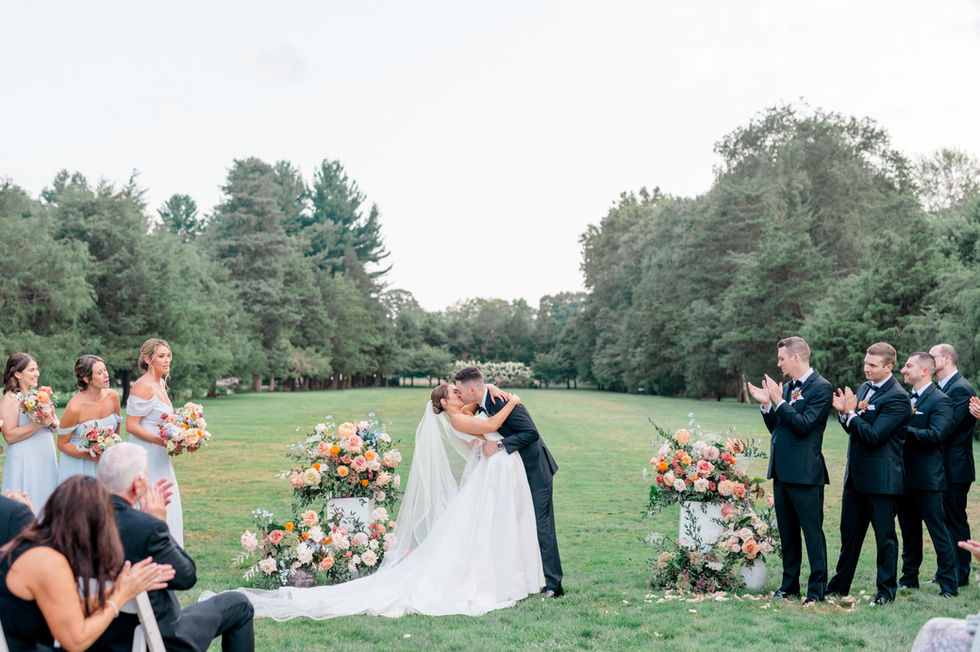 newlyweds first kiss at wedding ceremony at the Wadsworth Mansion