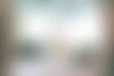 Wedding cake display in front of window at Eolia Mansion with garden view