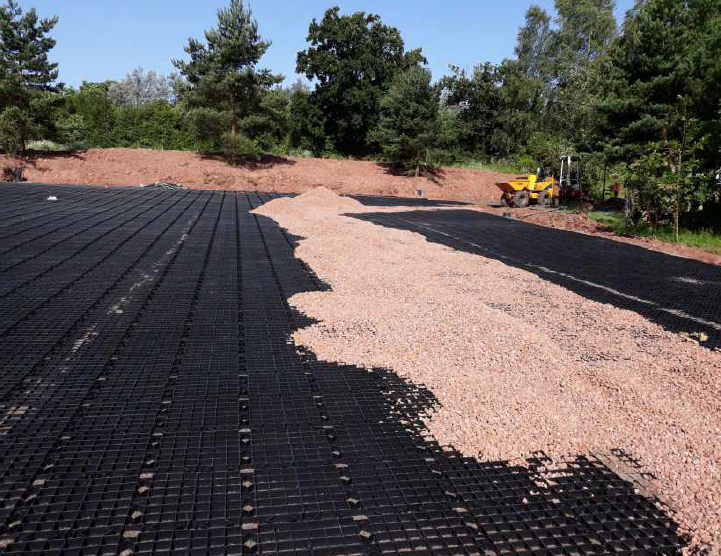 MetroPave recycled plastic permeable paving grids filled with gravel and grass for high-load-bearing driveways