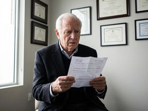 Business owner reflecting on legacy and succession planning, symbolizing a meaningful finish beyond money, ownership, and financial success.