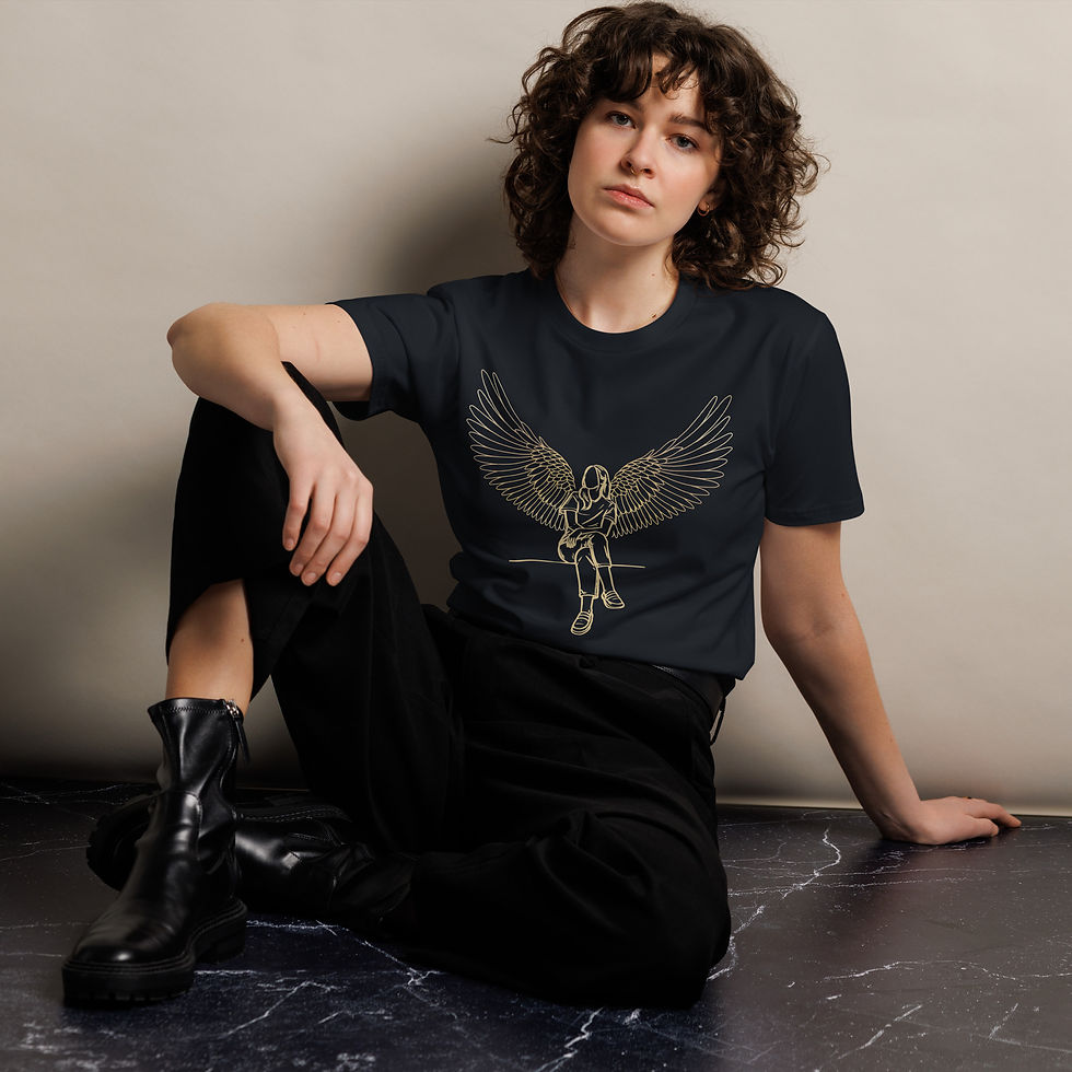 Thumbnail: Model sitting wearing a Navy premium cotton t shirt featuring the Divine Roots design, front view.