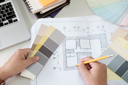 graphic-design-and-color-swatches-and-pens-on-a-desk-architectural-drawing-with-work-tools