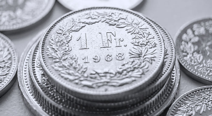 swiss-franc-coins-white-surface-value-sw