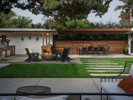 Outdoor kitchen and fire pit in a South O backyard.
