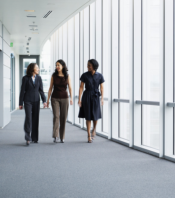 Businesswomen Walking in Hallway