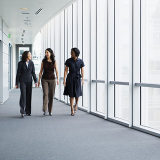 Businesswomen Walking in Hallway