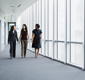 Businesswomen Walking in Hallway