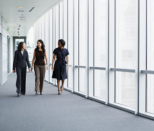 Businesswomen Walking in Hallway