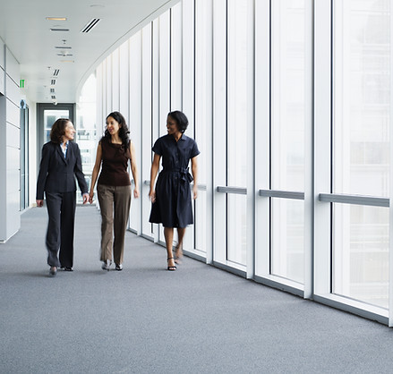 Businesswomen Walking in Hallway