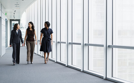 Businesswomen Walking in Hallway