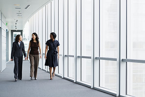 Businesswomen Walking in Hallway