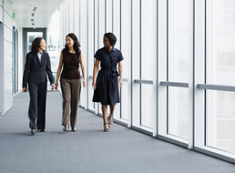 Businesswomen Walking in Hallway