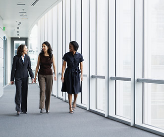 Businesswomen Walking in Hallway