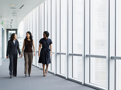 Businesswomen Walking in Hallway